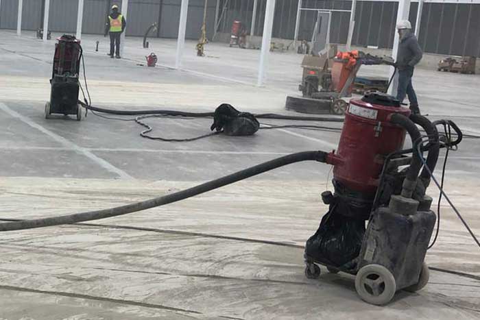 Preparing concrete floors with a grinder, Hobbs, NM